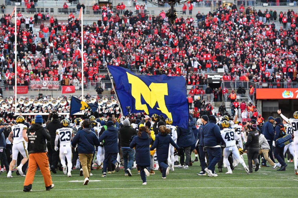 Flag-planting celebrations cause fights to break out in several heated college football rivalry games