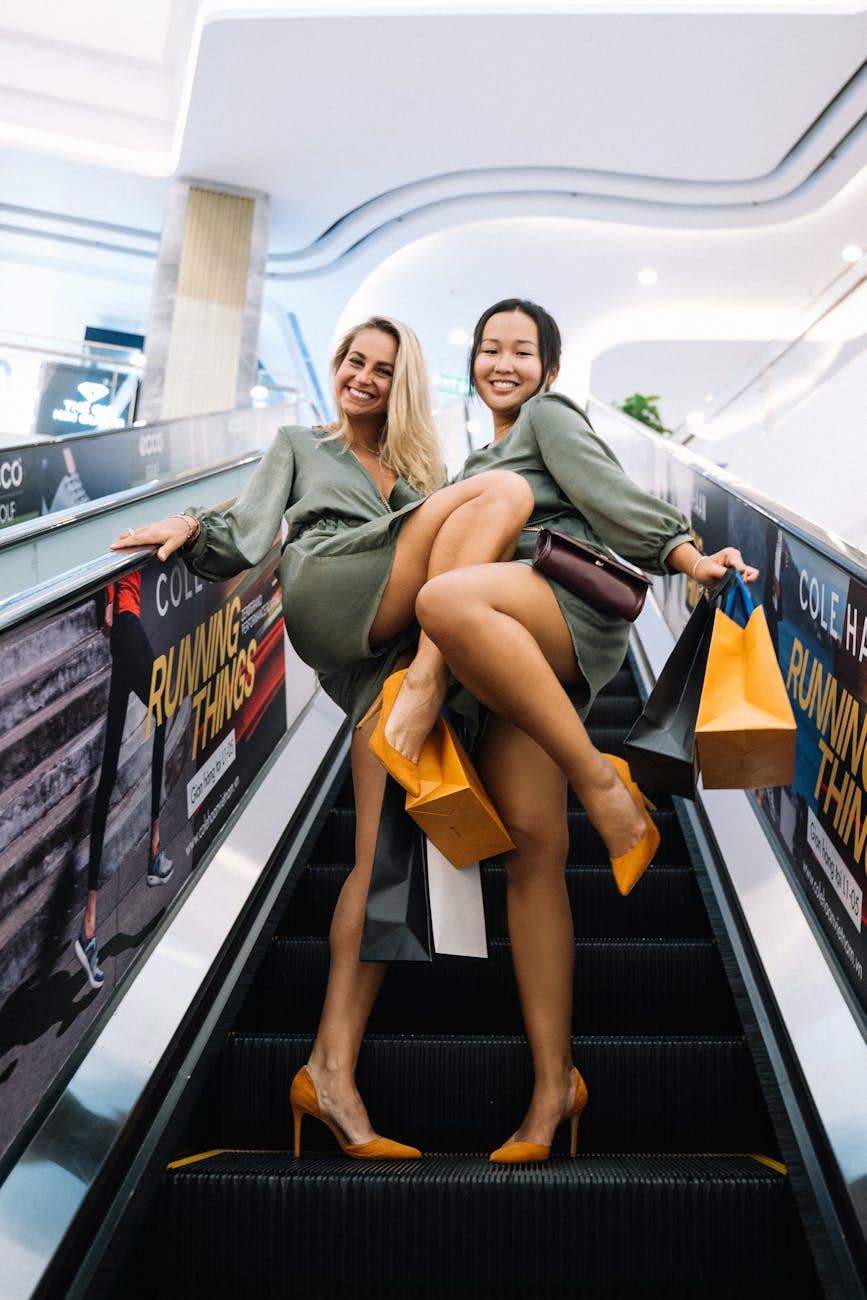 carefree women on escalator