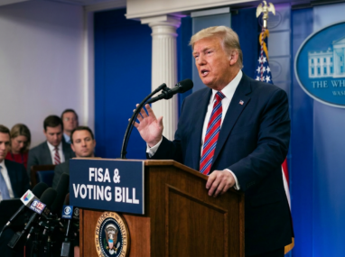 Donald Trump speaking at podium with sign reading 'FISA & VOTING BILLS' during press conference